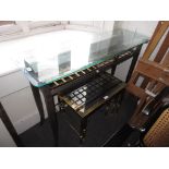 Modern wrought iron and glass hall table, 47ins wide together with a similar patinated metal and