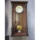 19th Century walnut Vienna wall clock, the ceramic dial with Roman numerals, with a single train