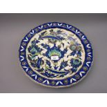 Iznik dish circa 1900 with a typical all-over floral design, 14ins diameter