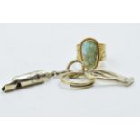 Yellow metal ring of pierced design set turquoise, together with a silver gilt dog whistle and