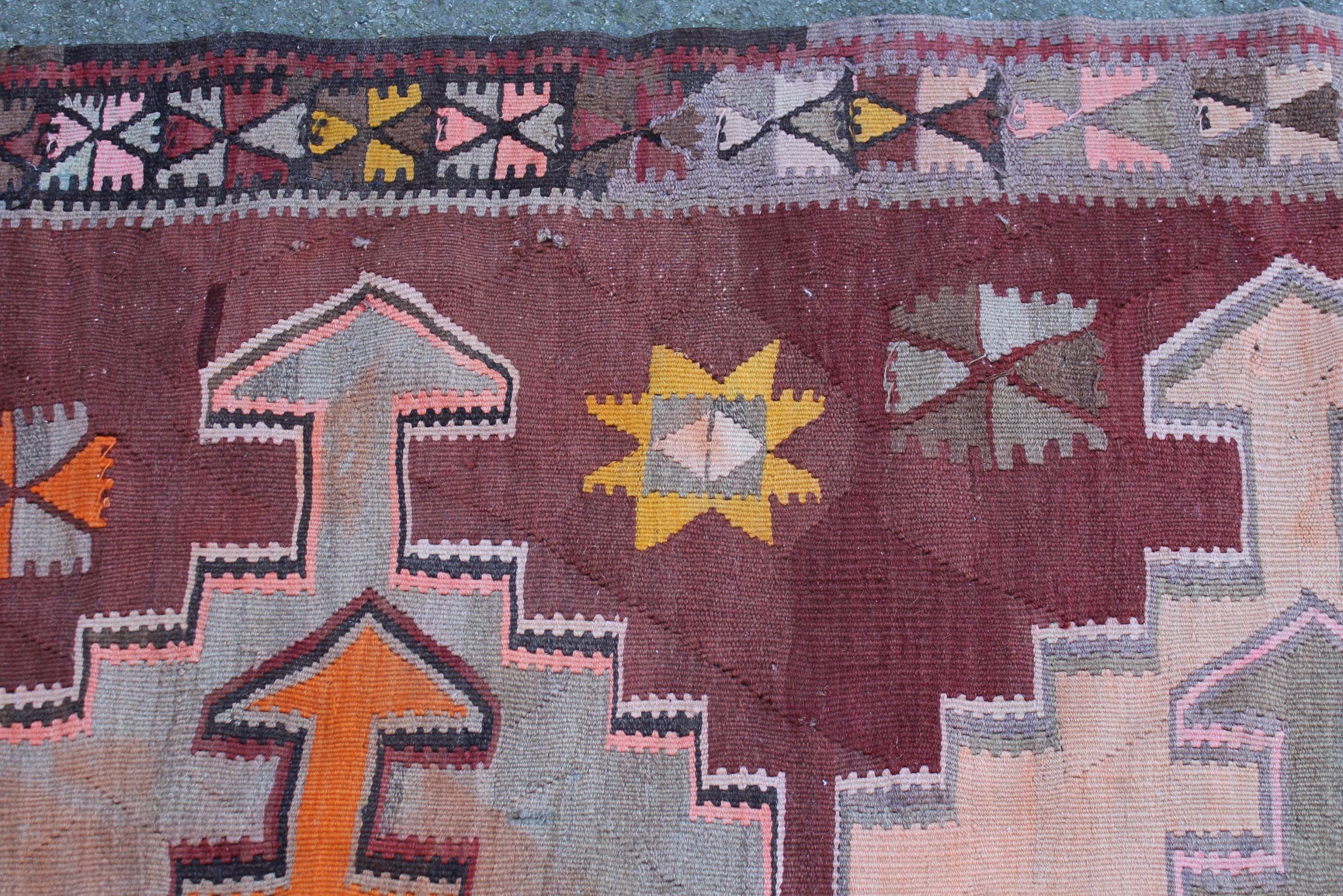 Kelim runner of all-over geometric design on a wine ground, approximately 10ft 6ins x 3ft 6ins - Image 2 of 2