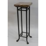 Late 20th Century patinated metal jardiniere stand, with brass paw feet and marble top, 36.5ins high