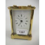 20th Century English gilt brass carriage clock, the enamel dial with Roman numerals, inscribed