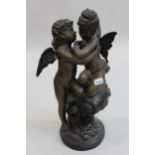 Late 20th Century patinated bronze figural group of two winged cherubs, embracing, 22ins high