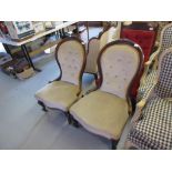 Near pair of Victorian carved walnut button upholstered balloon back chairs on cabriole supports