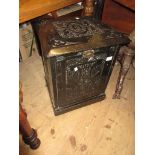 19th Century chip carved and ebonised coal scuttle having fall front, on plinth base with casters,