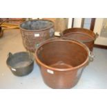 Copper and iron swing handled preserve pan, two similar preserve pans and an embossed copper coal