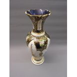 Large 20th Century blue glass baluster form vase with floral painted decoration on a white and
