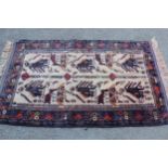 Small modern Belouch rug with animal and bird design on an ivory ground with borders, 4ft 10ins x