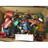 Box containing a quantity of various early playworn diecast metal vehicles including Dinky and Corgi
