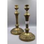 Pair of 19th Century French ormolu circular candlesticks with reeded columns and acanthus leaf