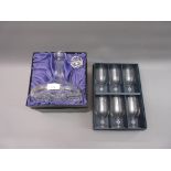 Boxed set of six etched glass goblets together with a boxed crystal decanter with stopper