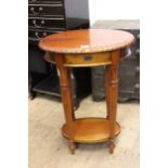 Reproduction mahogany oval side table with gadroon top and turned tapering reeded supports with