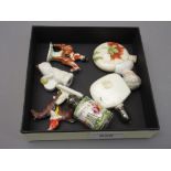 Three various miniature porcelain perfume bottles, miniature doll's head and three bisque cake