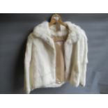 Ladies mink fur jacket, another dark fur jacket, together with a Sarah Noel white fur jacket The two