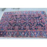 Antique Kurdish rug, having all over stylised floral design, midnight ground with multiple