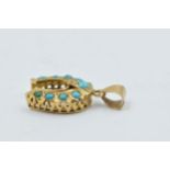 Middle Eastern yellow metal and turquoise horseshoe pendant, 2.5g