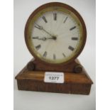 Small 19th Century rosewood cased drum clock with enamel dial and Roman numerals (at fault),