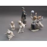 Lladro figure of Charlie Chaplin, Lladro group of two dancers and three Lladro cherub figures