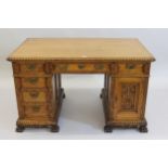 Early 20th Century honey oak pedestal partners desk, having moulded oak top, above an arrangement of