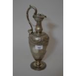 Victorian Scottish silver claret jug with scroll form handle and floral chased decoration, Edinburgh