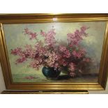 20th Century oil on canvas, still life, pink blossom in a blue vase, signed 'Stevens', framed 23in x