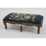 Small French rectangular carved beech footstool with needlework cover