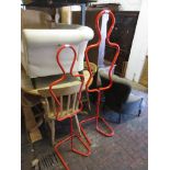 Two Modern red painted metal shop display dummies (one child sized and one adult sized) (at fault)