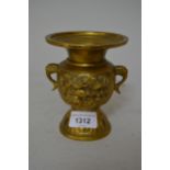 Japanese gilt patinated bronze two handled flared rim vase, relief moulded with panels of mythical