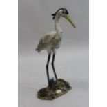 Pair of 20th Century painted metal garden figures of storks (one at fault), 27ins high