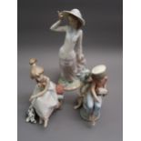 Lladro figure of a girl wearing a summer bonnet, 12ins high together with two similar smaller