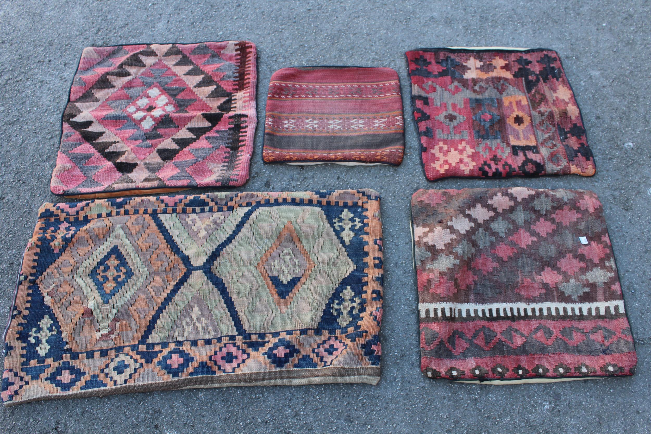 Five Kelim cushion covers and a small flat weave rug