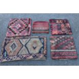 Five Kelim cushion covers and a small flat weave rug