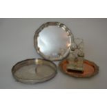 Circular silver plated salver, two plated trays and plated and glass condiments