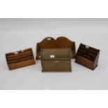 Late Victorian oak dome top stationery box (at fault) together with two wooden stationery racks