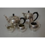 Silver plated four piece tea service, with sugar tongs and a small silver plated cream jug