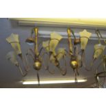Pair of 20th Century gilt patinated metal and wooden five branch chandeliers, with glass shades