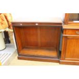 19th Century mahogany open bookcase of adjustable shelves on a plinth base, 41ins wide x 15.5ins