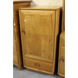 Ercol hi-fi cabinet, the hinged lid above a panel door and single drawer, 19.5ins x 38.75ins