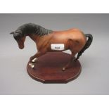 Royal Doulton bisque figure of a horse, on an oval wooden base