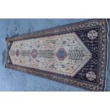 Abadeh runner with a medallion and all-over design on a blue ground with borders, 3.1m x 95cms