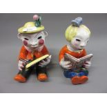 Pair of walter Bosse glazed terracotta figures of seated children with a book and chalkboard, 7.