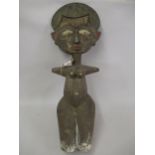 African carved wooden painted and embossed metal mounted standing fertility figure, 38ins high