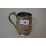 S. Kirk & Son (American), small silver baluster form mug with all-over repousse floral decoration,