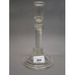 19th Century glass candlestick in 18th Century style, the knopped air twist stem above circular dome