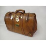 Tan leather holdall with brass mounts