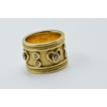 Heavy 18ct gold wide band ring set with diamonds in heart motifs, 17.5g 17.5g Size K 1/2 In good