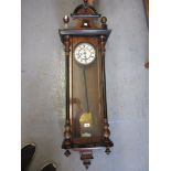 19th Century walnut and ebonised Vienna wall clock, the enamel dial with Roman numerals and