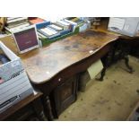 Victorian mahogany serpentine fronted side table, the shaped frieze raised on turned tapering