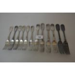 Mixed set of six silver Fiddle pattern dinner forks together with five similar dessert forks, and